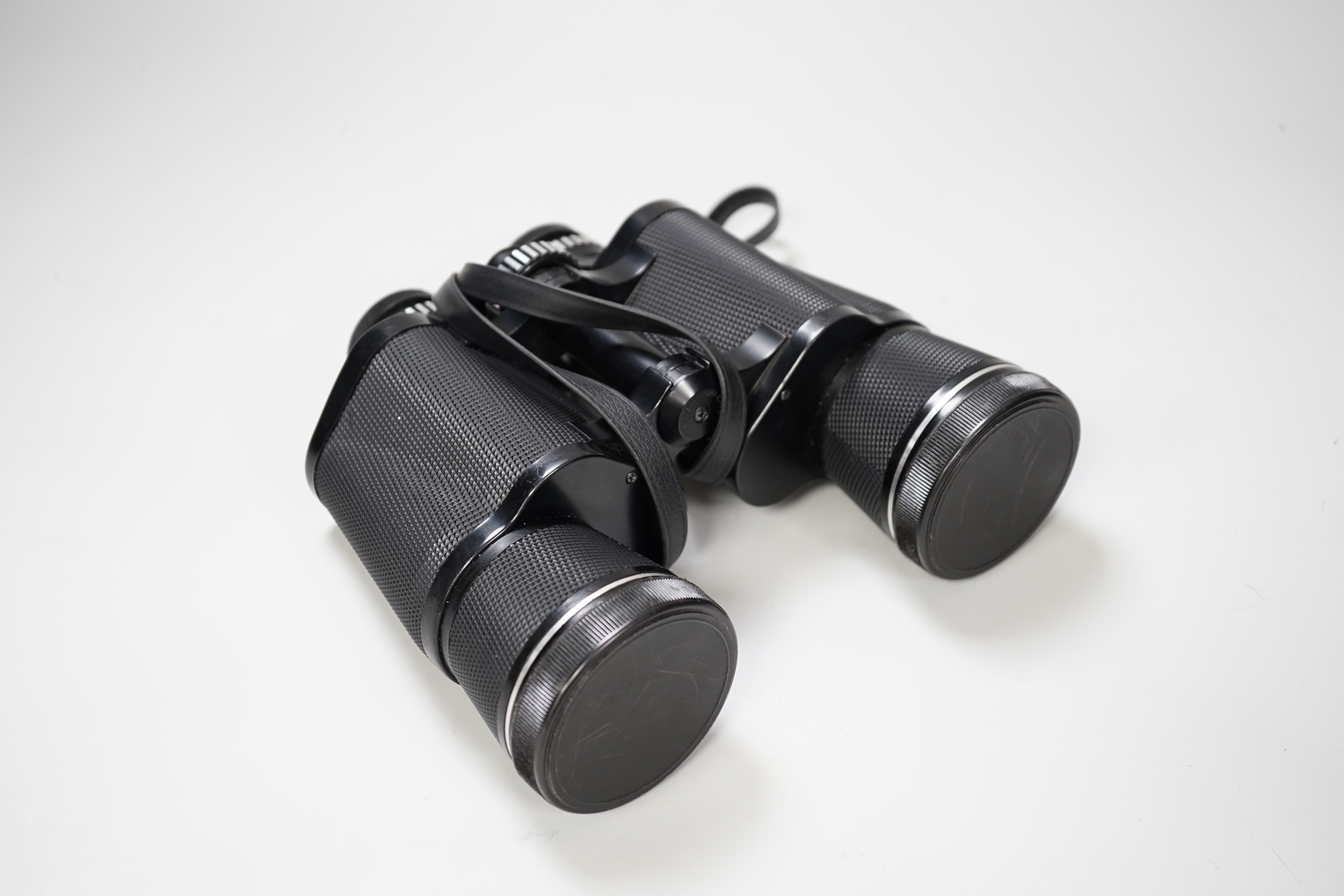 A pair of Prinzlux binoculars 10 x 50 and a pair of Tasco binoculars 20 x 60